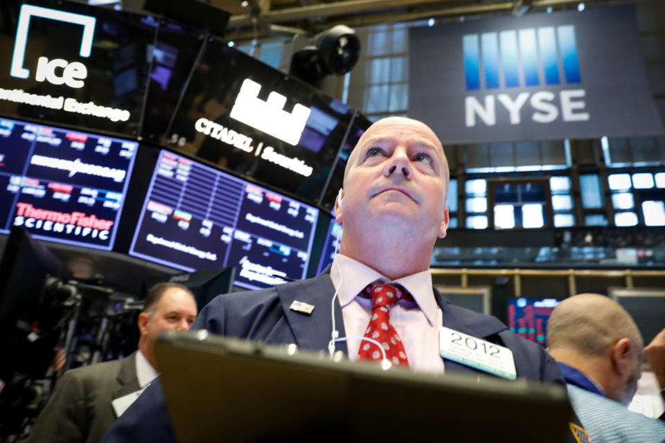 Traders work on the floor at the New York Stock Exchange (NYSE) in New York, U.S., August 5, 2019. REUTERS/Brendan McDermid