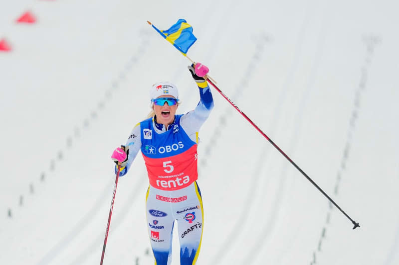 Sweden's Frida Karlsson celebrates her victory after the women's 50 km mass start classic race during the FIS Cross-Country World Cup in Oslo. Beate Oma Dahle/NTB/dpa