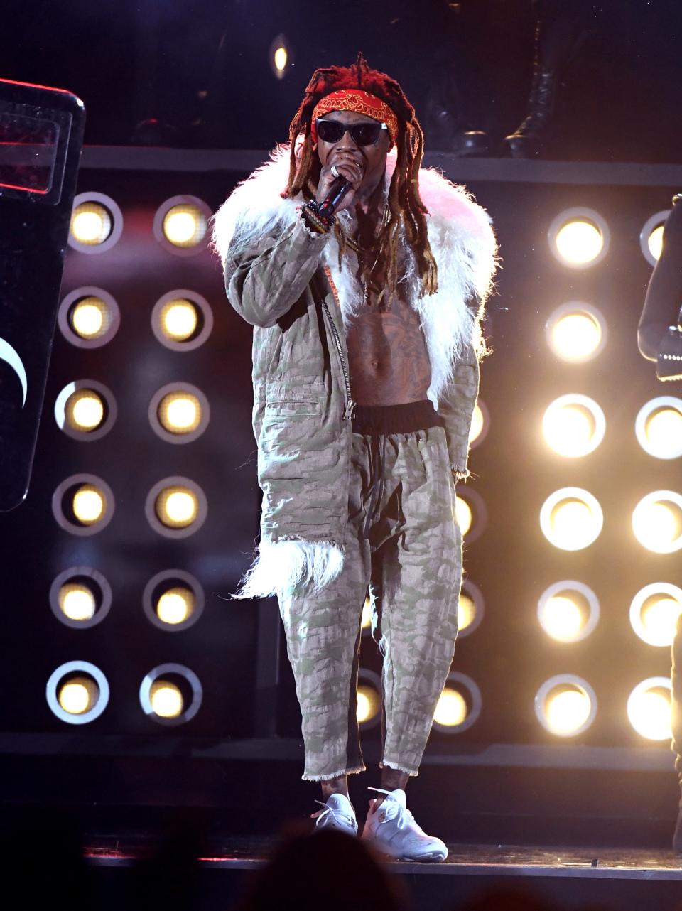 <p>We don't know just how much air conditioning was pumping through the T-Mobile Arena, but it we hope it was a lot if Wayne was performing in this beast fur-lined jacket (then again maybe going shirtless in it offsets the whole body temperature situation?) and matching cropped sweatpants.</p>