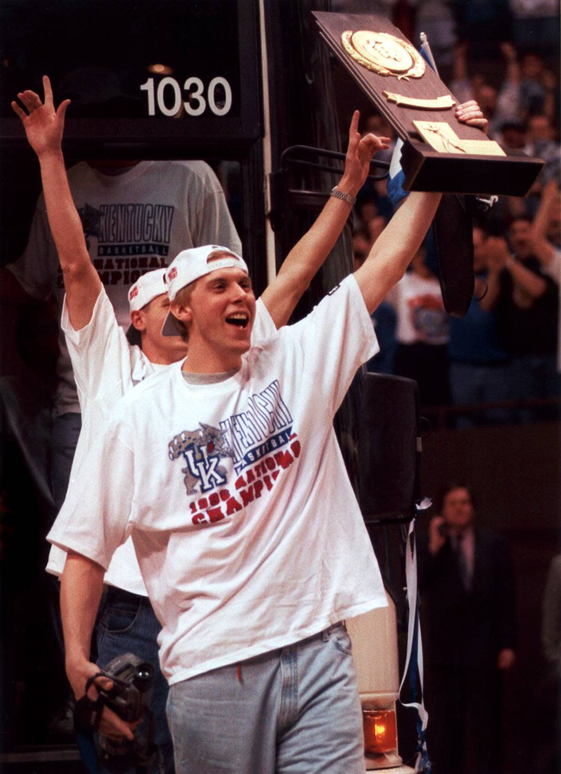 UK basketball player Mark Pope carries the 1996 NCAA Championship Trophy into Rupp Arena for a special ceremony honoring the team’s Final Four victory over Syracuse 76-67, April 2, 1996. This was UK’s 6th NCAA National Championship.