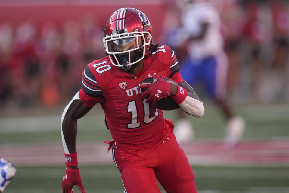 Utah wide receiver Money Parks scores a touchdown against Florida early in the game Thursday, Aug. 31, 2023, in Salt Lake City. (AP Photo/Rick Bowmer)