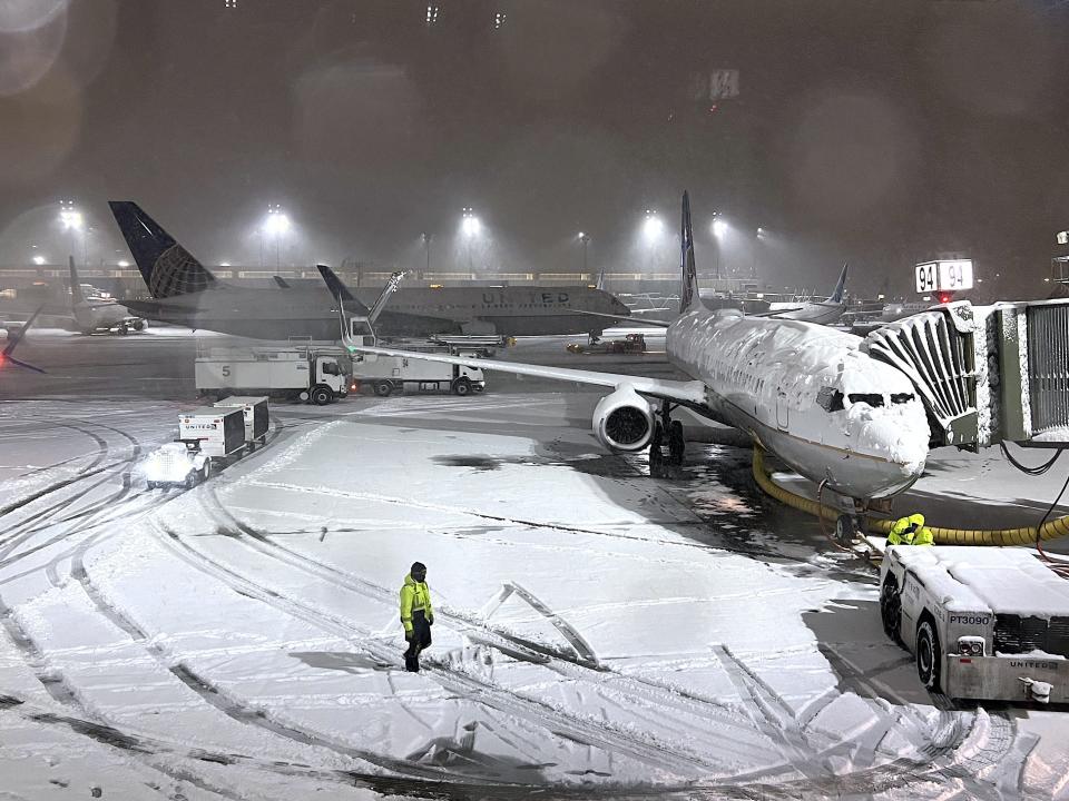 NEW JERSEY, USA - JANUARY 07: Airplane runway covered with snow at Newark Liberty International Airport on January 7, 2022 in New Jersey, United States as massive snow storm hits the east coast.