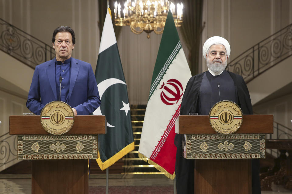 In this photo released by the official website of the office of the Iranian Presidency, Iranian President Hassan Rouhani, right, and Pakistani Prime Minister Imran Khan give a joint press conference at the Saadabad Palace, in Tehran, Iran, Sunday, Oct. 13, 2019. (Office of the Iranian Presidency via AP)