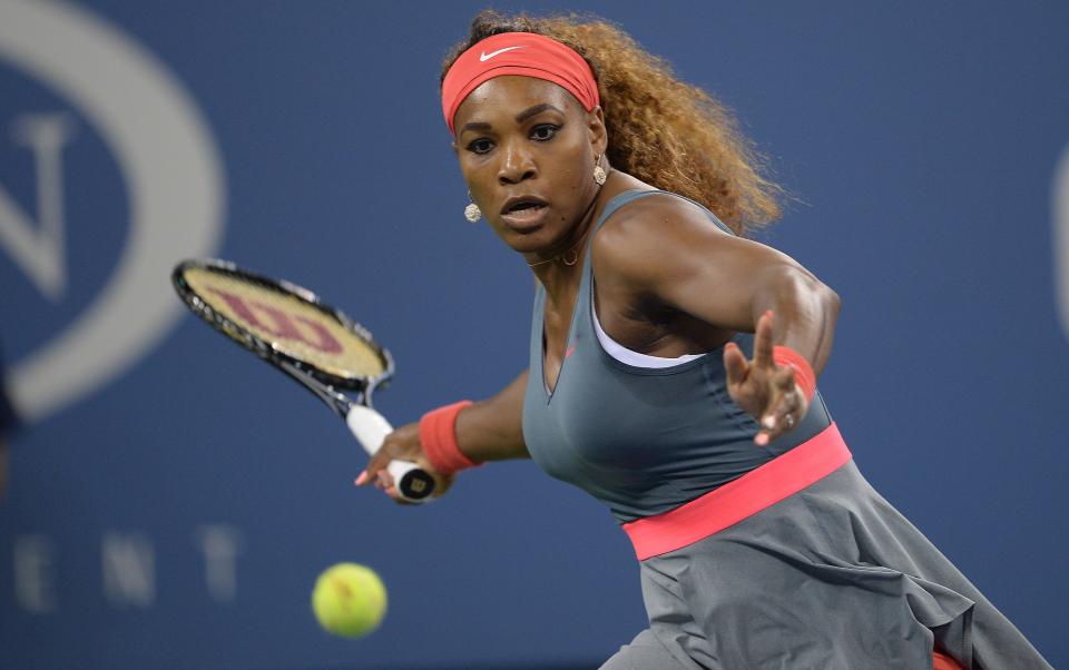 US tennis player Serena Williams returns a point to Italy's Francesca Schiavone during their 2013 US Open women's singles match at the USTA Billie Jean King National Tennis Center in New York on August 26 , 2013        (Photo credit should read EMMANUEL DUNAND/AFP/Getty Images)