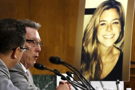 Jim Steinle (L), father of murder victim Kathryn Steinle (in photo, R), allegedly at the hands of an undocumented immigrant, testifies about his daughter's murder during a hearing of the Senate Judiciary Committee on U.S. immigration enforcement policies, on Capitol Hill in Washington July 21, 2015. REUTERS/Jonathan Ernst