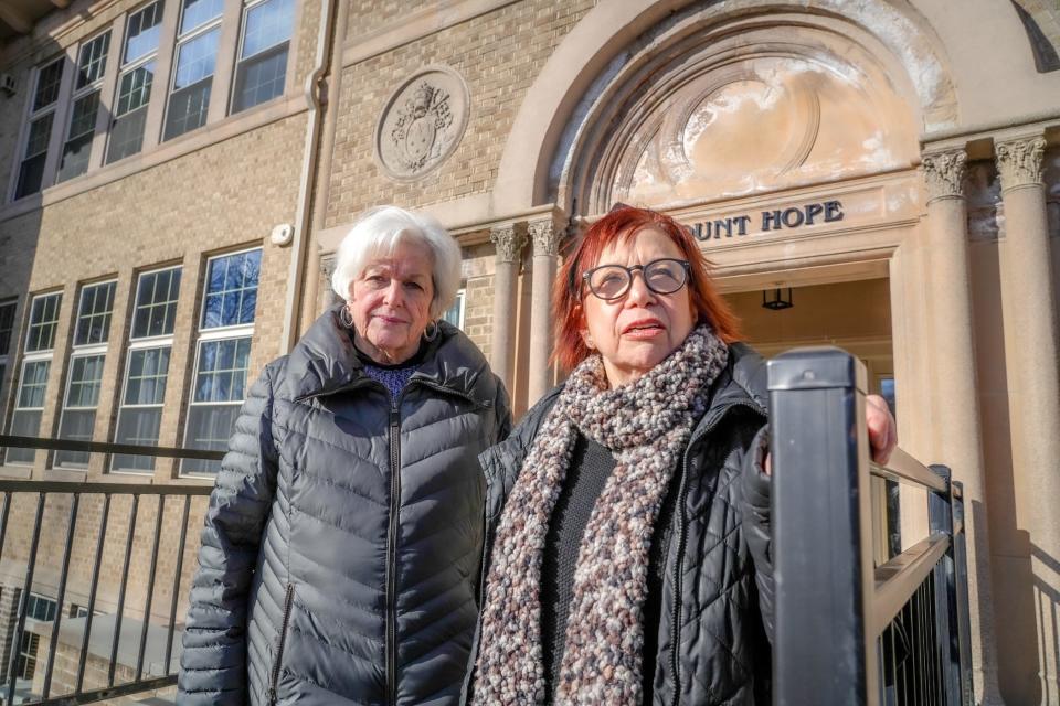 Judith Glynn, left, and Stephanie Isenberg stand outside the Chapel Hill East condo development in Providence, which they say has been plagued by problems.  [David DelPoio/The Providence Journal, file]
