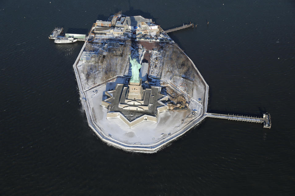 The Statue of Liberty stands on a snowy Liberty Island on January 5, 2018 in New York City.&nbsp;