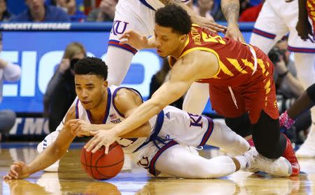 Jan 21, 2019; Lawrence, KS, USA; Kansas Jayhawks forward Dedric Lawson (1) and Iowa State Cyclones guard Lindell Wigginton (5) dive for a loose ball in the second half at Allen Fieldhouse. Mandatory Credit: Jay Biggerstaff-USA TODAY Sports
