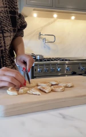 <p>Kylie Jenner/Tiktok</p> Kylie Jenner cutting pancakes