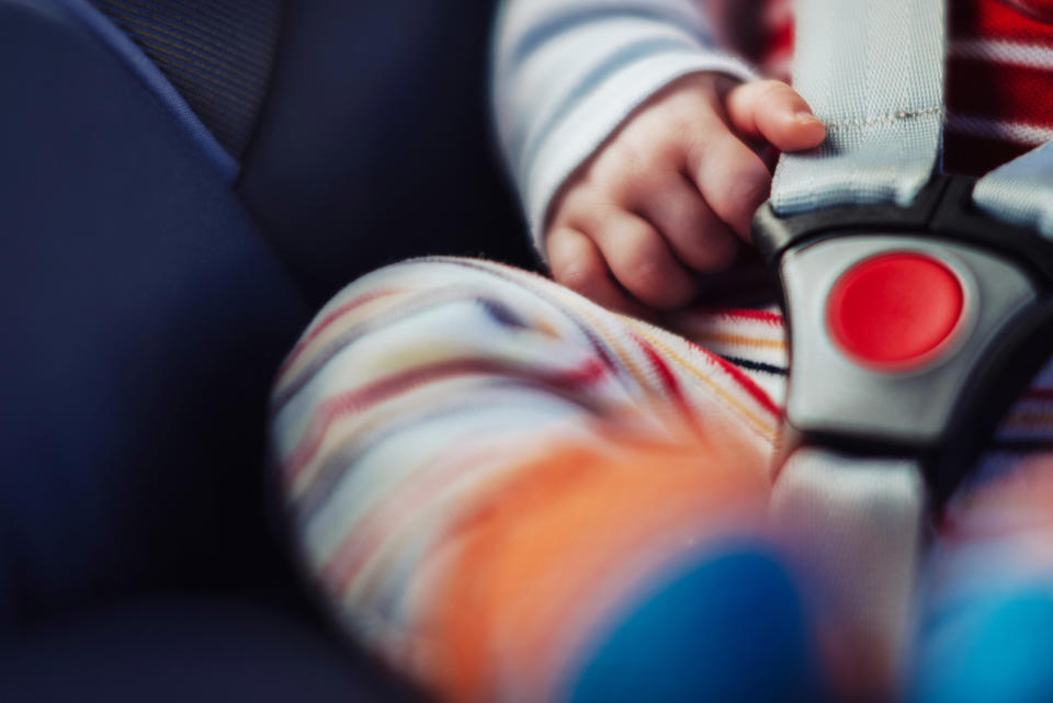 Close-up of a baby in a car seat