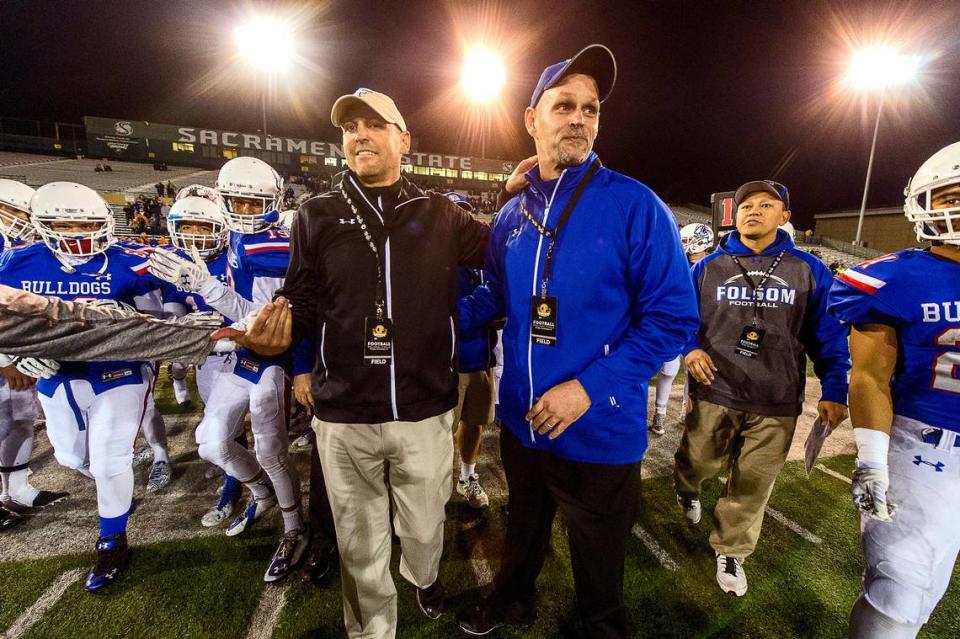 Folsom High School Bulldog’s head coaches Troy Taylor and Kris Richardson, celebrate their 52-21 victory over Grant High School in the CIF Northern California Regional Division I football championship game at Sacramento State, Friday December 12, 2014. Brian Baer/Special to the Bee
