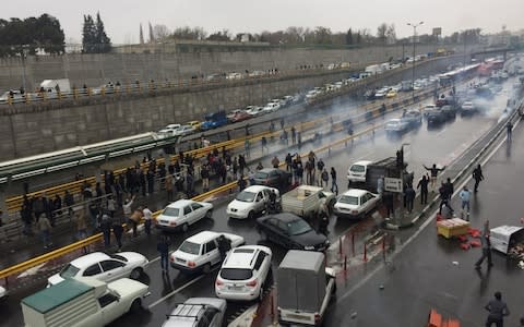 Protesters blocked roads with their parked cars - Credit: Nazanin Tabatabaee/WANA