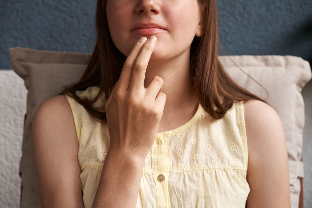 girl practicing EFT or Emotional freedom technique Getty Images/Madeleine_Steinbach