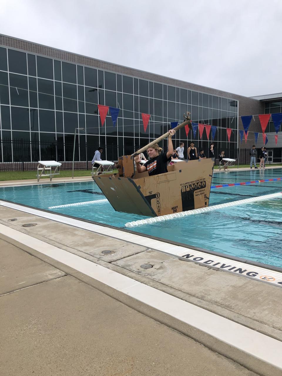 A boat and paddler almost across the pool. Photo courtesy of Tyler ISD.