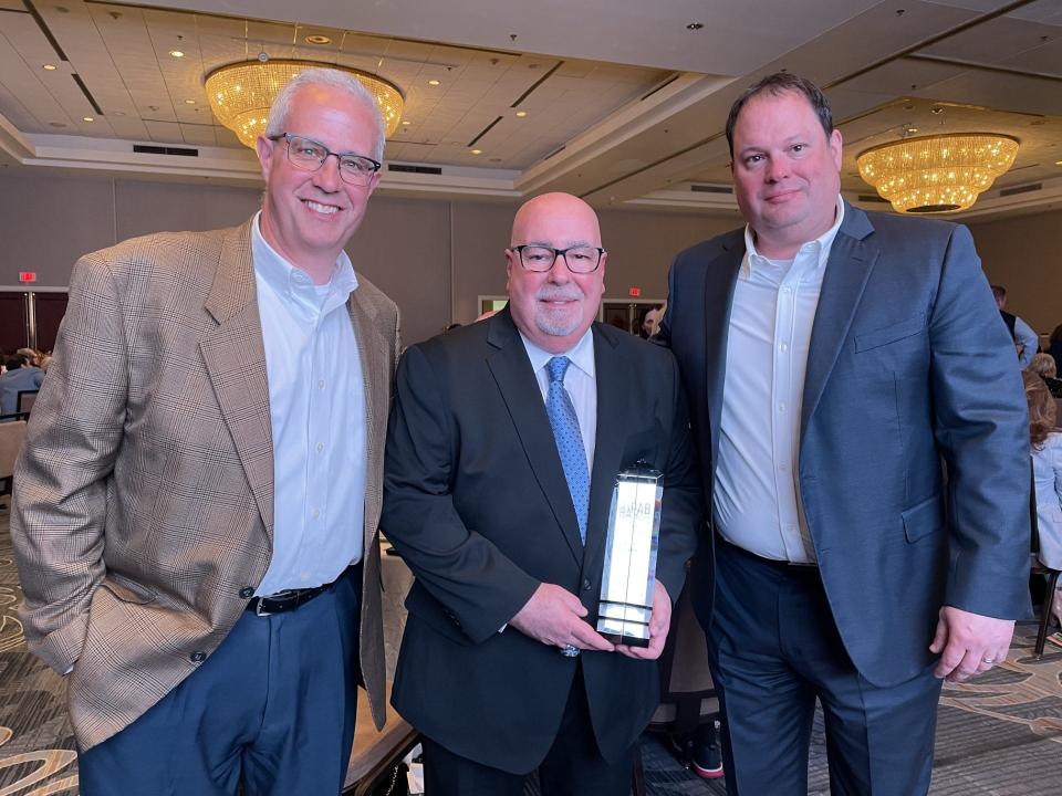 RMU Senior Associate Athletic Director Marty Galosi (Left) Chris Shovlin (Center) and Robert Morris Vice President and Director of Athletics Chris King at the Pa. Association of Broadcasters Hall of Fame Luncheon in Harrisburg, PA on April 26, 2024.