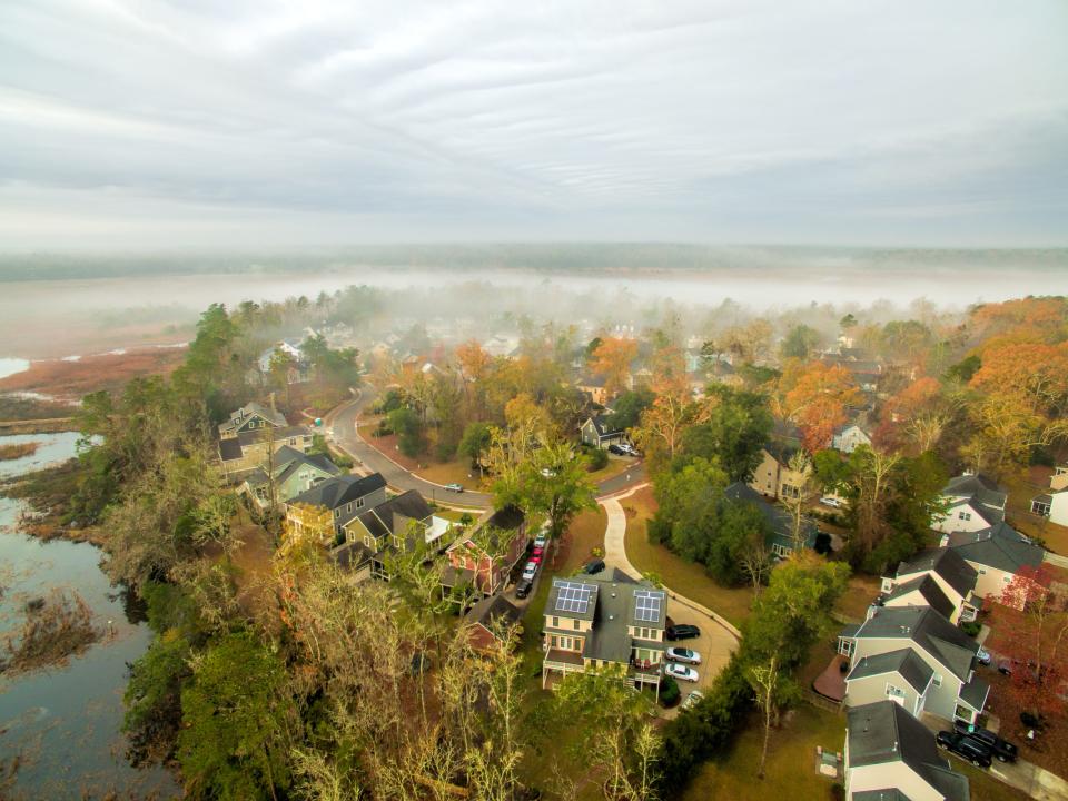 Foggy aerial view of a North Charleston neighborhood near the river