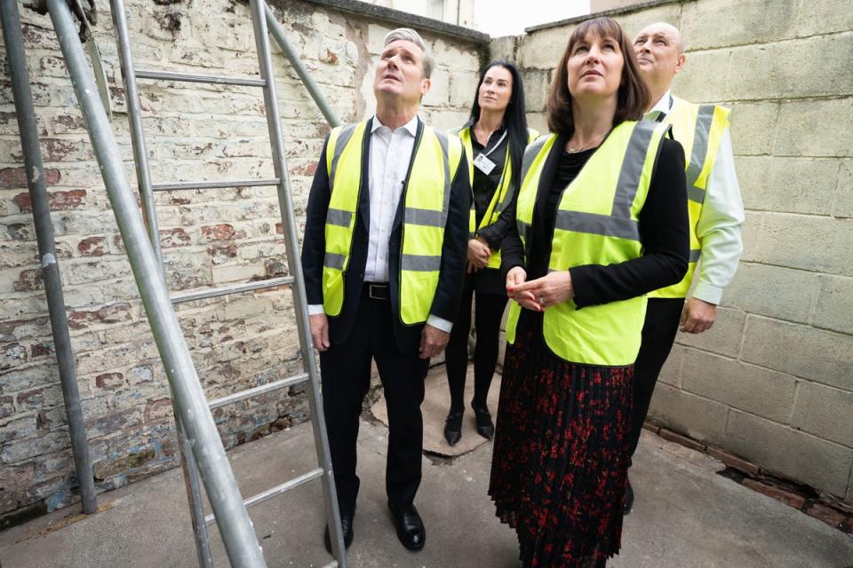 Labour leader Sir Keir Starmer and shadow chancellor Rachel Reeves visit an insulation project on a social housing site in Bootle (Stefan Rousseau/PA) (PA Wire)