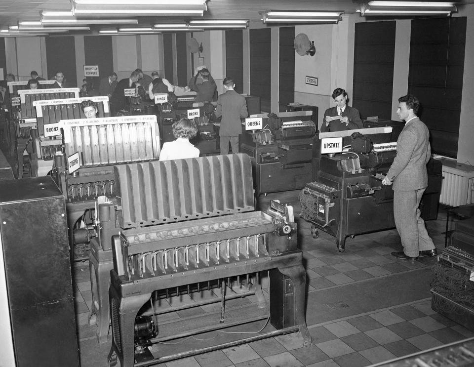 This battery of tabulating machines plays an important part in the gathering of the election returns by the Associated Press in New York, Nov. 3, 1942. The returns, coming in by teletype, are classified and counted with the aid of these and other machines of special design. (AP Photo/Matty Zimmerman)