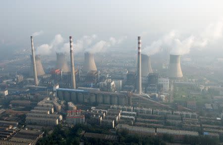 An aerial view shows a coal-burning power plant on the outskirts of Zhengzhou, Henan province, China, August 28, 2010. REUTERS/Stringer/File Photo