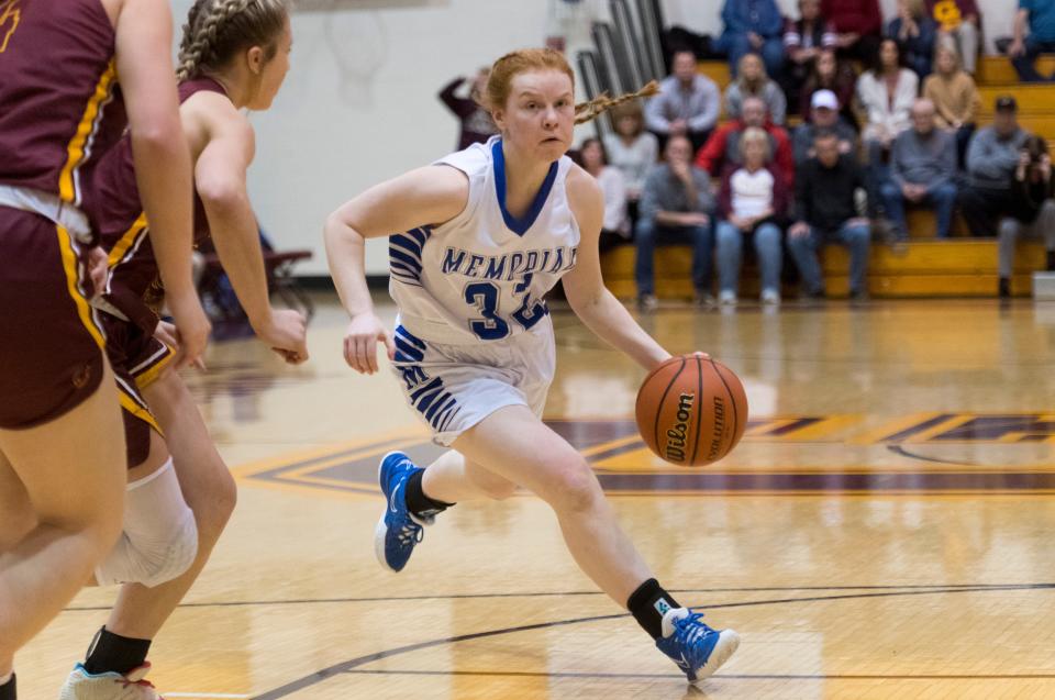 Memorial’s Avery Kelley (32) drives the ball as the Memorial Lady Tigers play the Gibson Southern Lady Titans during the Class 3A girls basketball sectional championship game at Gibson Southern High School Tuesday night, Feb. 8, 2022. 