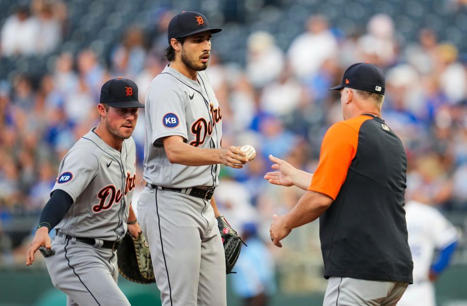Tigers pitcher Alex Faedo hands the ball to manager A.J. Hinch as he exits the game during the second inning against the Royals in the second game of the doubleheader on Monday, July 11, 2022, in Kansas City, Missouri.