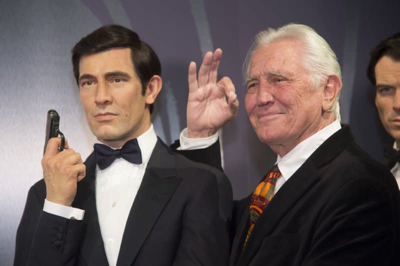 George Lazenby visits his Madam Tussauds wax figure. File Photo by Phil McCarten/UPI