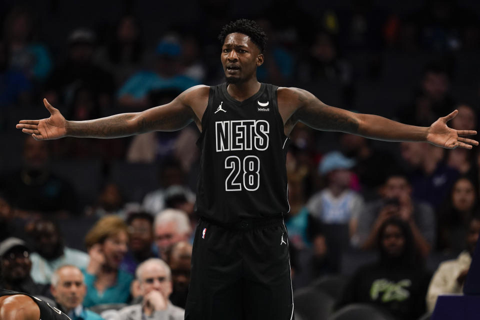 Brooklyn Nets forward Dorian Finney-Smith reacts after a play in the first half of an NBA basketball game against the Charlotte Hornets, Monday, Oct. 30, 2023, in Charlotte, N.C. (AP Photo/Erik Verduzco)