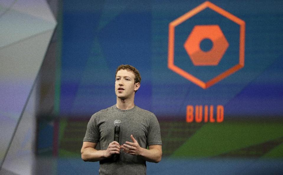 Facebook CEO Mark Zuckerberg gestures while delivering the keynote address at the f8 Facebook Developer Conference Wednesday, April 30, 2014, in San Francisco. (AP Photo/Ben Margot)