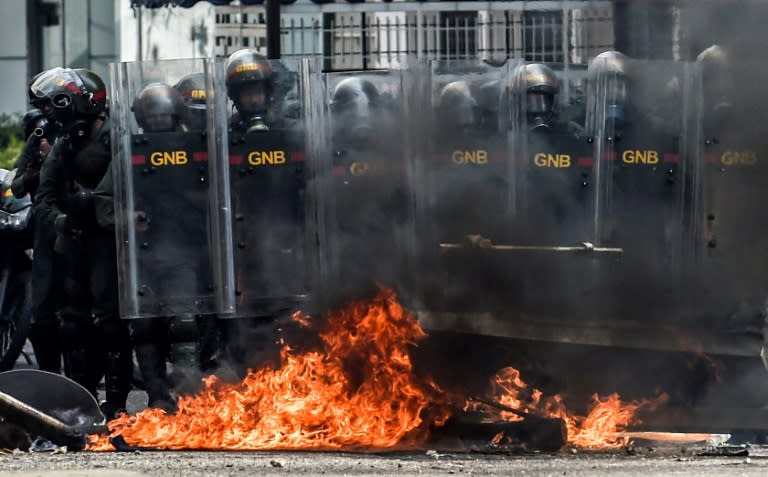 Members of the National Guard crack down on opposition demonstrators during a march against President Nicolas Maduro, in Caracas on April 26, 2017