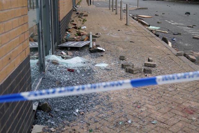 Broken glass and discarded bricks among damage at the Holiday Inn Express in Tamworth