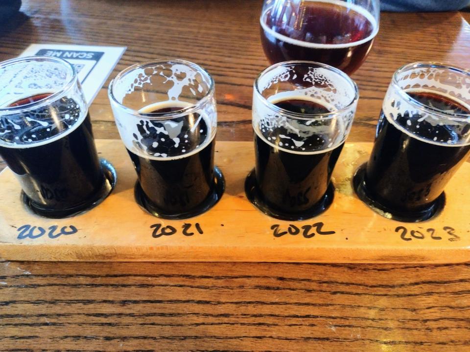 Pair a dark beer with your plate of oysters, like Valholl Brewing's flight of Thunderbolt Imperial Stouts from 2020, 2021, 2022 and 2023.