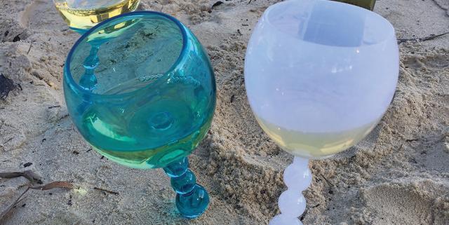 You Can Buy These Floating Wine Glasses That Stick Up In the Sand for $2 at  Aldi
