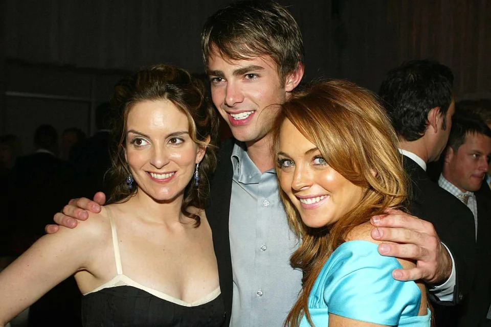 <p>Kevin Winter/Getty</p> Tina Fey, Jonathan Bennett and Lindsay Lohan at the 2004 Mean Girls premiere