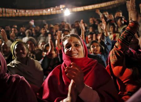 Supporters of Bharatiya Janata Party (BJP) cheer as Sanjeev Balyan (not pictured), the agriculture minister and a member of BJP, addresses a by-election campaign rally in Muzaffarnagar district in Uttar Pradesh, February 9, 2016. REUTERS/Anindito Mukherjee