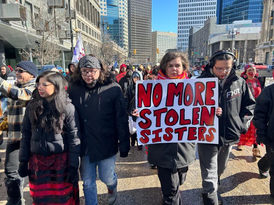 Demonstrators march down Portage Avenue in Winnipeg as they continue to demand a search for the remains of First Nations women believed to be located beneath the surface of the Prairie Green landfill. 