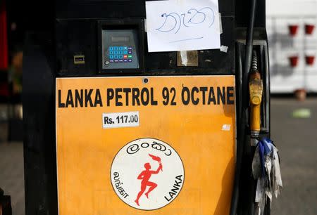 A sign reading, "No Fuel" is seen at a closed Ceylon Petroleum fuel station near the highway entrance in Galle, Sri Lanka July 26, 2017. REUTERS/Dinuka Liyanawatte
