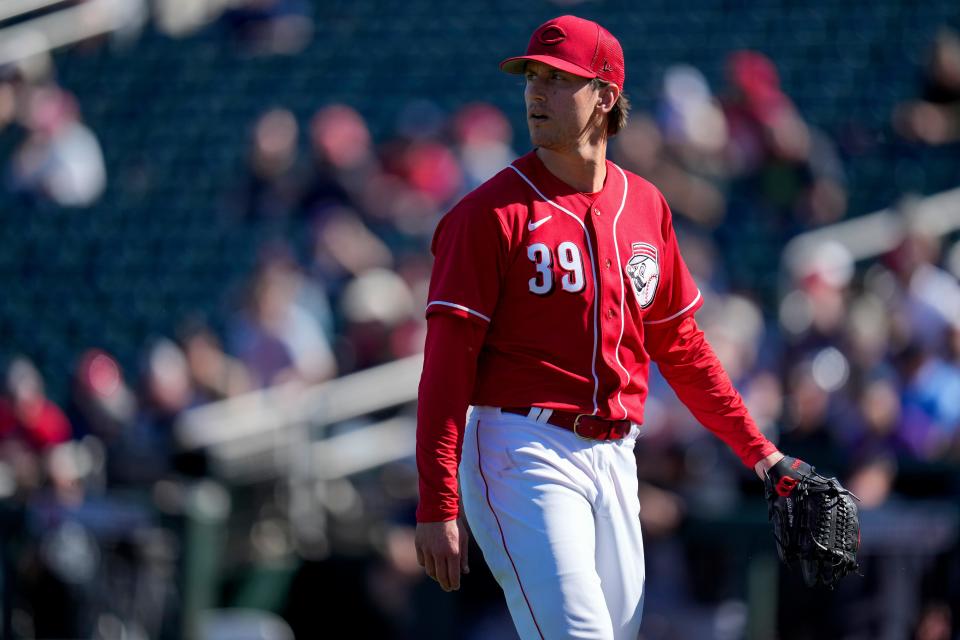 Reds reliever Lucas Sims returns to the dugout after a spring training appearance on Feb. 25.