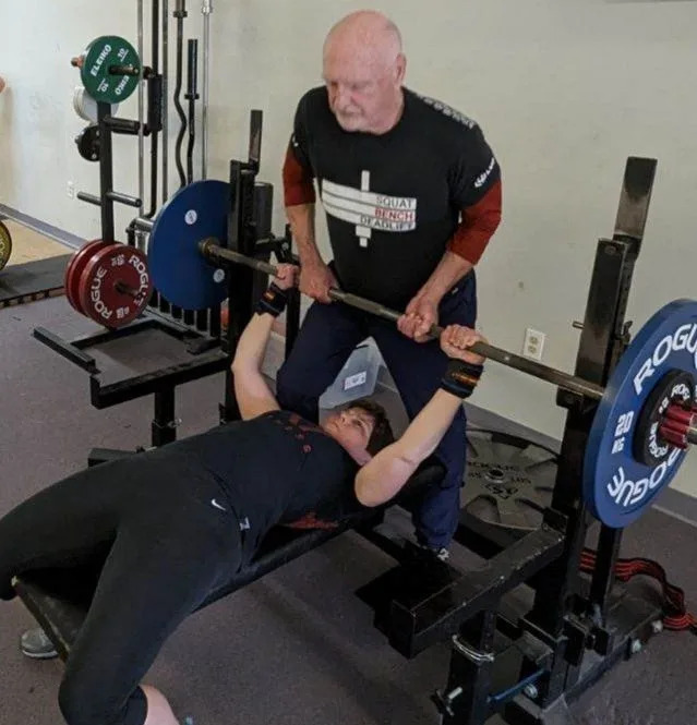 Peter Hubbard, 85, spots his wife, Nona, 61, during a recent weight-lifting workout. Both will compete at the Powerlifting America New Hampshire State Championship at The Lift Free or Die Gym in Dover starting at 9 a.m.