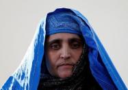 Sharbat Gula, the green-eyed "Afghan Girl" whose 1985 photo in National Geographic became a symbol of her country's wars, arrives to meet with Afghanistan's President Ashraf Ghani in Kabul, Afghanistan November 9, 2016. REUTERS/Mohammad Ismail