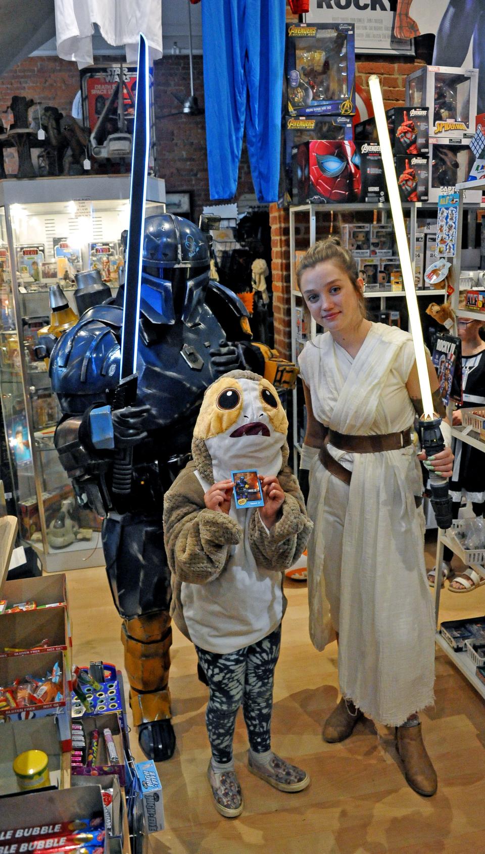 (Left to right) Rob Smith, Quinn and Maeve Gardner and McCartney Sorg pose in their Star Wars costumes at Operation Fandom on May 4. Smith is from Zanesville. He recently traveled to a comic book convention in Tennessee where he got three autographed Star Wars figurines. He gave those to Operation Fandom to be sold.