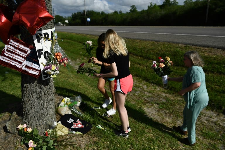 Residents leave flowers at a memorial for victims of a mass shooting at Santa Fe High School in Santa Fe, Texas