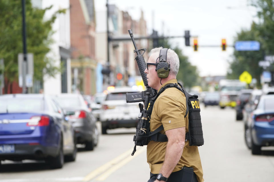 A law enforcement officer responds to gunfire in the Garfield neighborhood of Pittsburgh on Wednesday, Aug. 23, 2023. (Sebastian Foltz/Pittsburgh Post-Gazette via AP)/Pittsburgh Post-Gazette via AP)