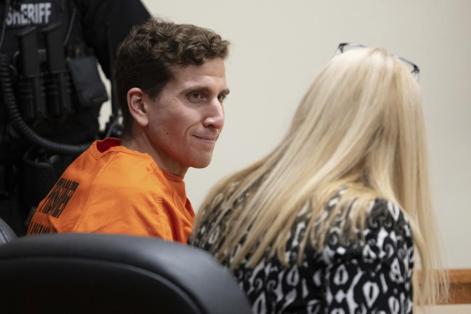 FILE - Bryan Kohberger, left, who is accused of killing four University of Idaho students in Nov. 2022, looks toward his attorney, public defender Anne Taylor, right, during a hearing in Latah County District Court on Jan. 5, 2023, in Moscow, Idaho. Thirty news organizations have asked the Idaho Supreme Court to overturn a sweeping gag order in a case against Kohberger who is accused of stabbing the four students to death. (AP Photo/Ted S. Warren, Pool, File)