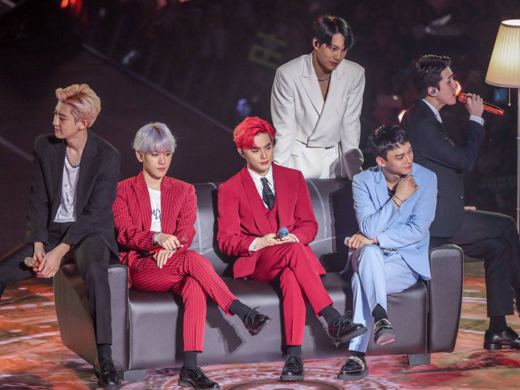 (L-R) Chanyeol, Baekhyun, Suho, Kai (standing), Chen and Sehun at their recent concert in Kuala Lumpur.