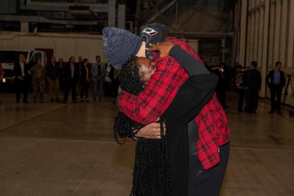 This photo provided by the U.S. Army shows WNBA star Brittney Griner, right, being greeted by wife Cherelle after arriving at Kelly Field in San Antonio following her release in a prisoner swap with Russia on Dec. 9, 2022.