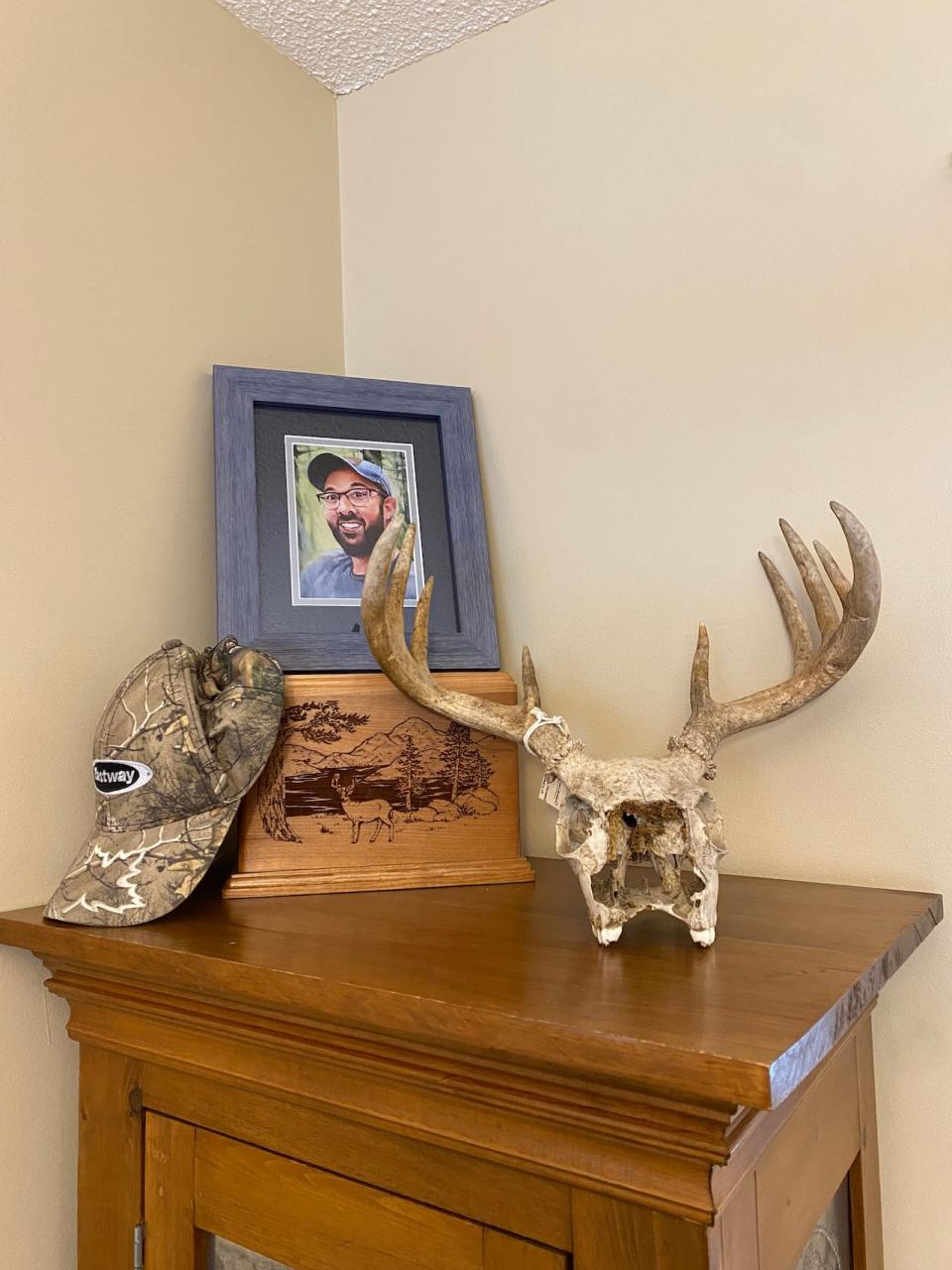 Danny Beale's photo, along with his Eastway hat sit by a decorative box holding his ashes.