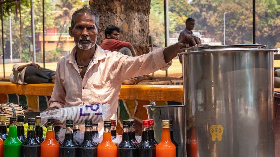 Chanu Gupta, a shaved ice vendor in Mumbai, poses for a picture during an interview with CNN on April 16, 2024. - Noemi Cassanelli/CNN