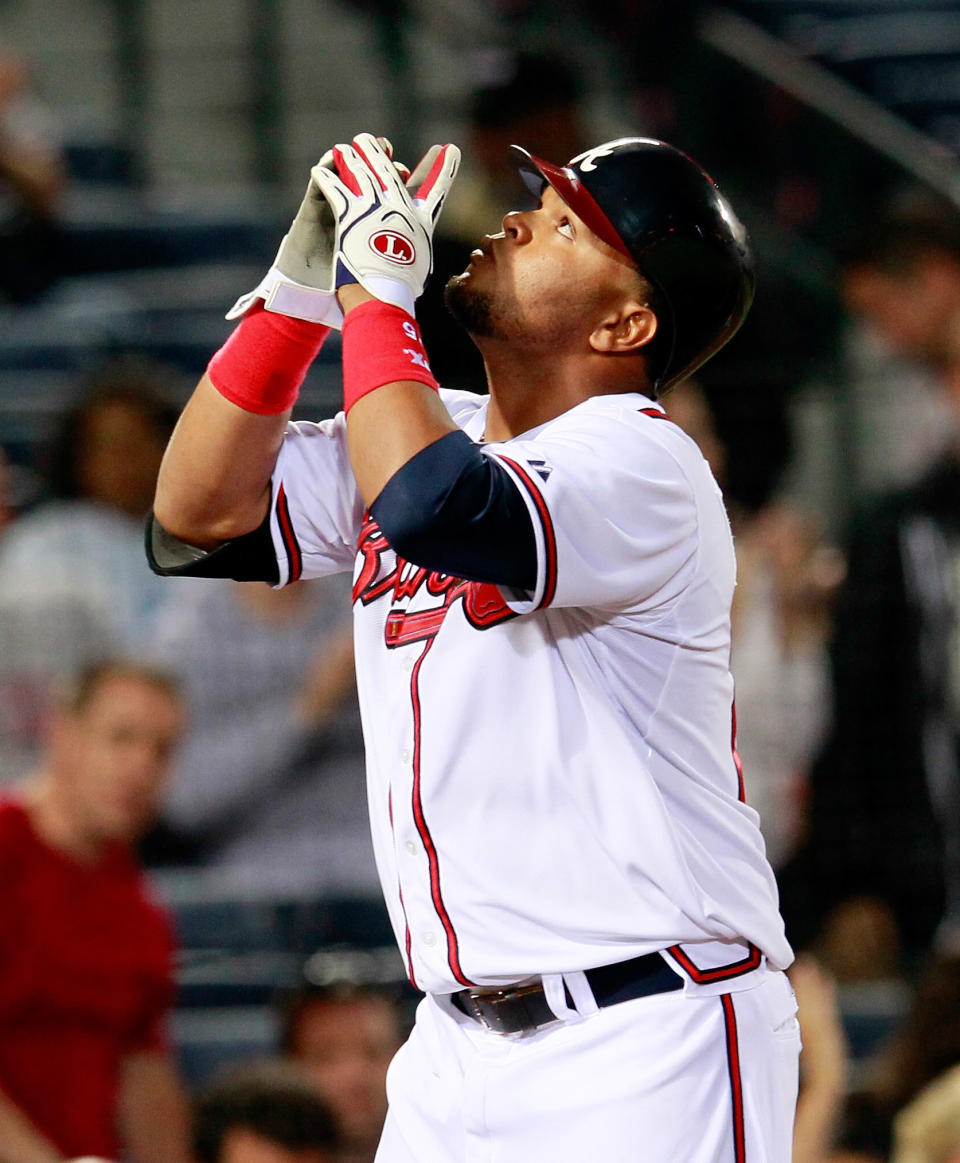 ATLANTA, GA - APRIL 17: Juan Francisco #25 of the Atlanta Braves reacts after hitting a solo homer in the eighth inning against the New York Mets at Turner Field on April 17, 2012 in Atlanta, Georgia. (Photo by Kevin C. Cox/Getty Images)