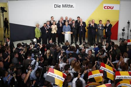 Christian Democratic Union CDU party leader and German Chancellor Angela Merkel reacts on first exit polls in the German general election (Bundestagswahl) in Berlin, Germany, September 24, 2017. REUTERS/Pawel Kopczynski