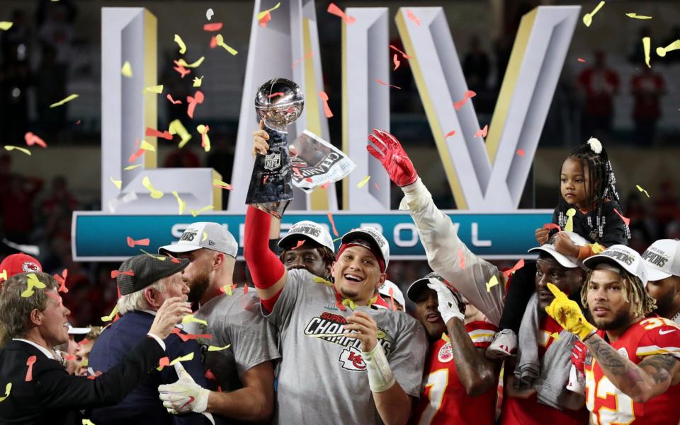 Patrick Mahomes celebrates with the Vince Lombardi trophy after winning the Super Bowl LIV.  - REUTERS